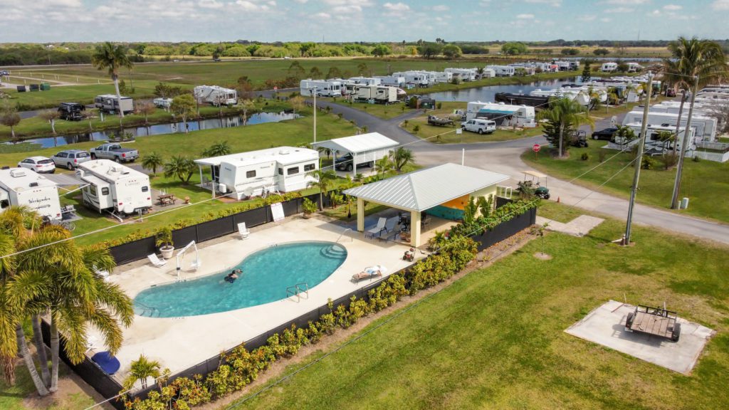 Starlite RV Park with pool and pond, aerial view